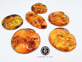 Cognac Amber Carved Faces Cabochons